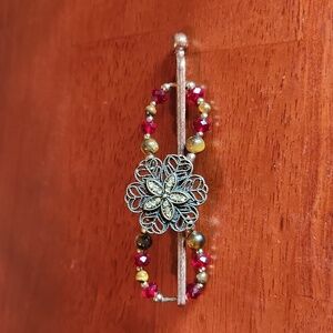 Lillarose, medium flexi hair clip. Bronze with red gems